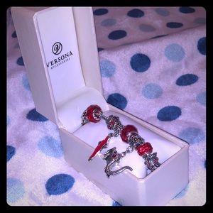 A versona bracelet with different charms on it